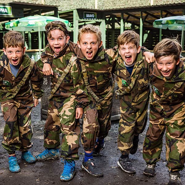 Squad in camo gear at base camp